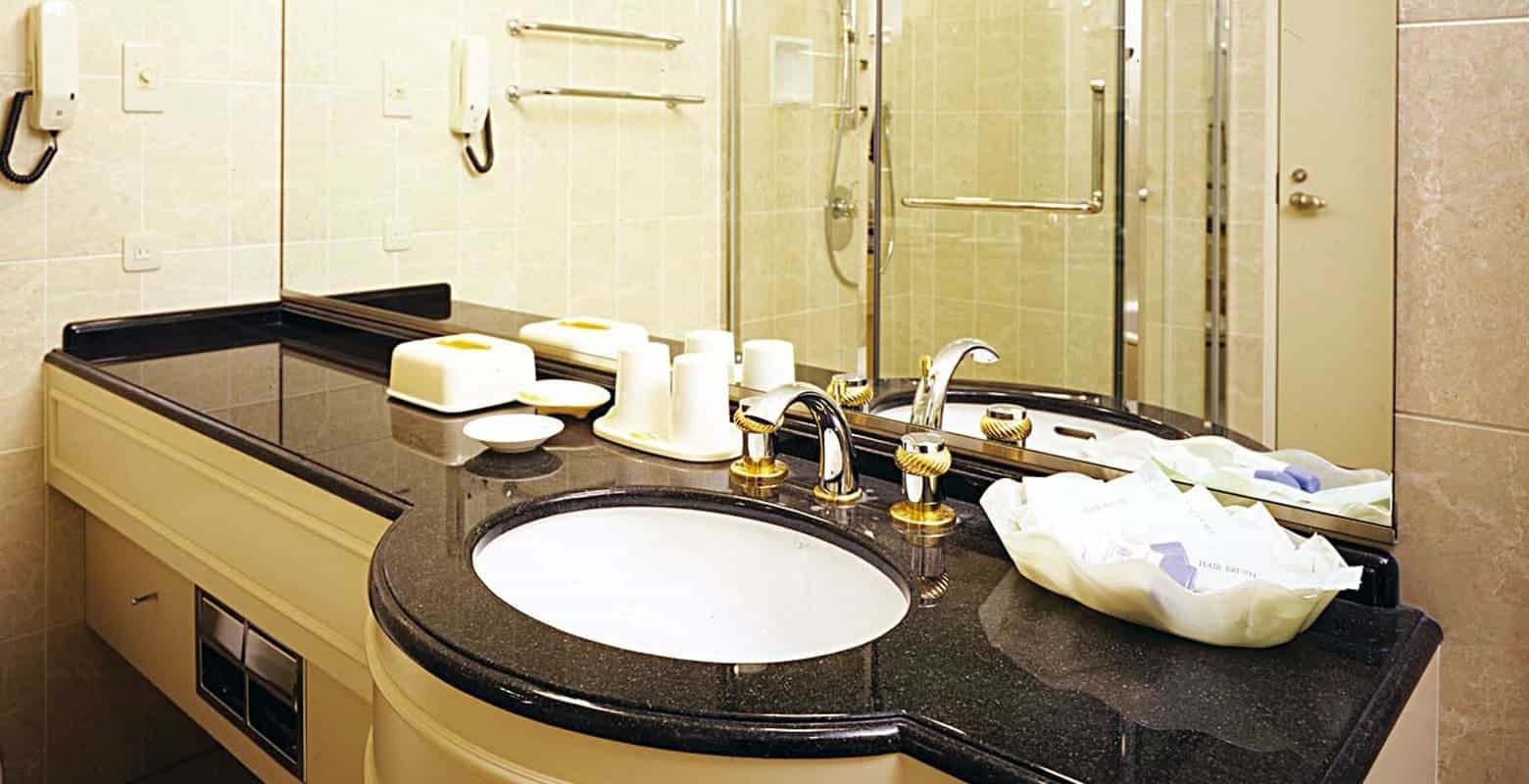 Freshen up in a twin room's bathroom at Imabari Kokusai