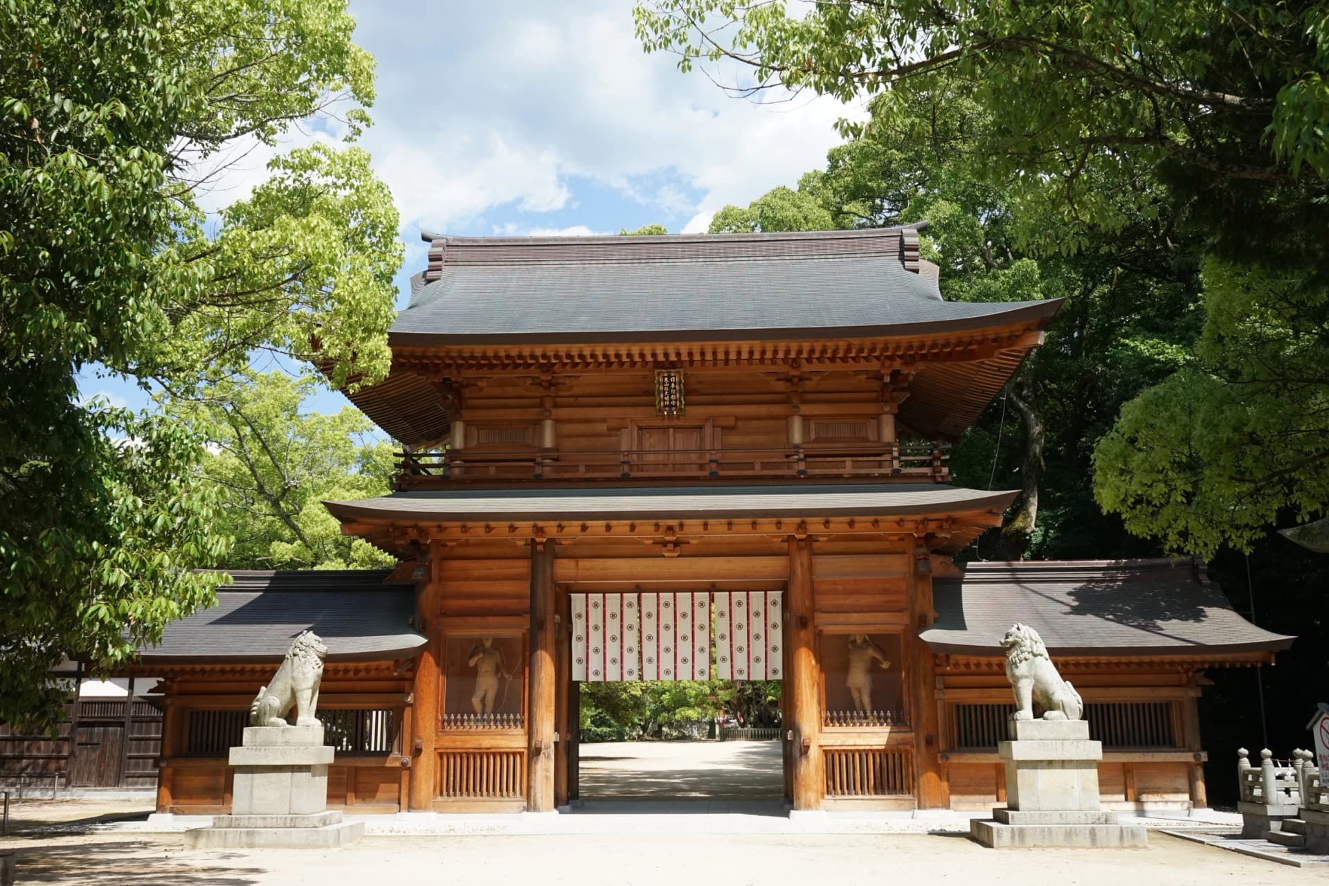 Walk through the wooden gate of Ōyamazumi Shrine