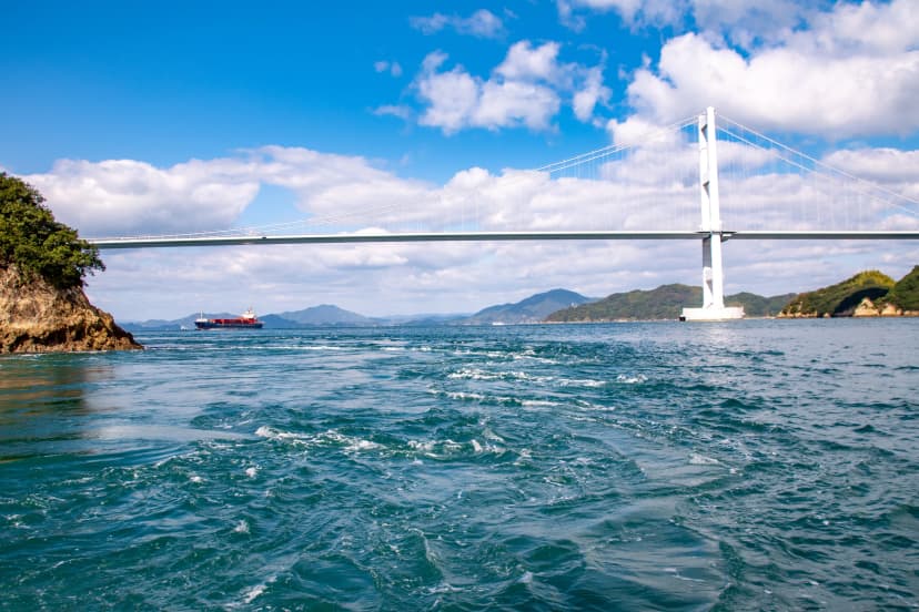 Watch a ship pass under the Kurushima-Kaikyō Bridge