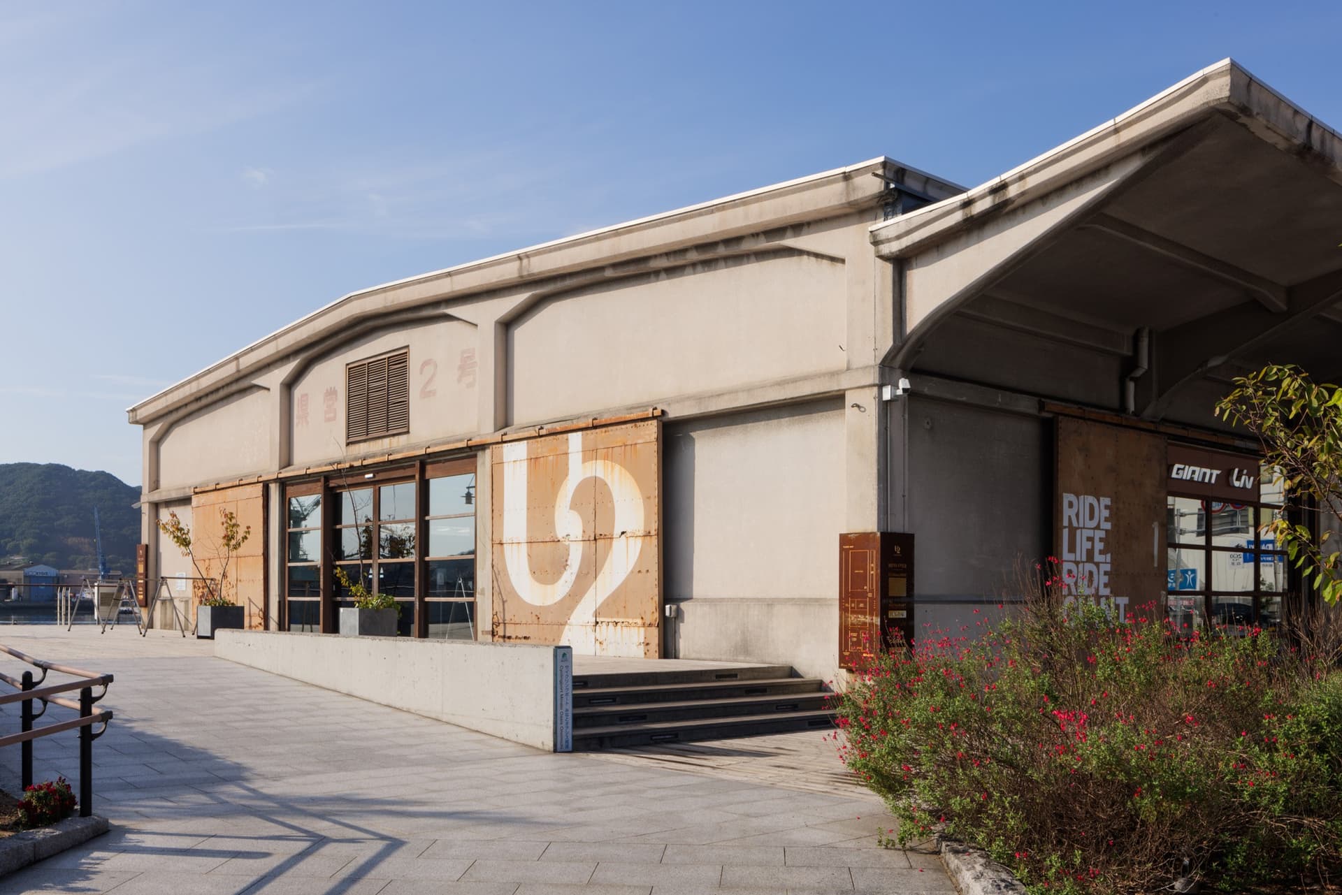 Arrive at ONOMICHI U2, the warehouse home of Hotel Cycle