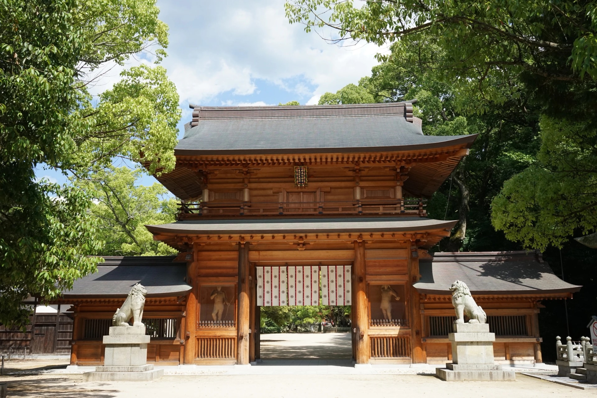 Walk through the wooden gate of Ōyamazumi Shrine